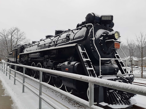 The 6167 Locomotive. Its black paint covered by a fresh blanket of snow.